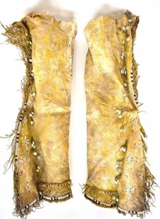 19th Century Prairie, Plains and Plateau Native American Beaded Buckskin Leggings or Chaps with Fringe and Shells. Hide stiff with age.  Some condition issues.
