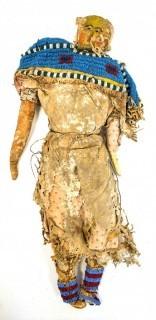 19th Century Prairie, Plains and Plateau Native American Doll, Possibly Sioux, Made of Hide and Flour Bag Muslin with Beaded Yoke.  Fabric and hide loss.  Measures 22" long. 