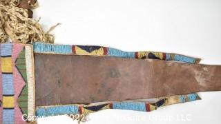 19th Century Prairie, Plains and Plateau Native American Ceremonial Beaded Leather Crupper with Hand Forged Metal Spoon Fringe.  Bead Work mostly intact, but condition issues on verso.  {Note: Description altered 3/6/22 @ 3:53pm ET and more photos added 3-7-22 @ 8:15am ET}