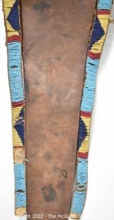 19th Century Prairie, Plains and Plateau Native American Ceremonial Beaded Leather Crupper with Hand Forged Metal Spoon Fringe.  Bead Work mostly intact, but condition issues on verso.  {Note: Description altered 3/6/22 @ 3:53pm ET and more photos added 3-7-22 @ 8:15am ET}