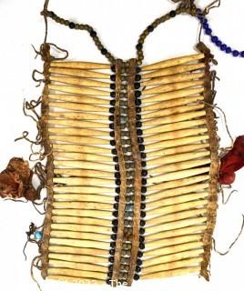 19th Century Prairie, Plains and Plateau Native American Warrior Long Bone and Hide Breastplate.  9" x 11" 