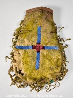 19th Century Prairie, Plains and Plateau Native American Beaded Hide Pouch with Rawhide Fringe.  