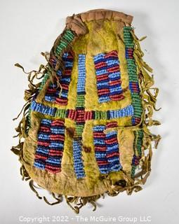 19th Century Prairie, Plains and Plateau Native American Beaded Hide Pouch with Rawhide Fringe.  