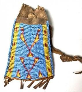 19th Century Prairie, Plains and Plateau Native American Blue, Yellow and Red Beaded Pouch with Metal Cone Shaped Bells on Edge and Rawhide Drawstring