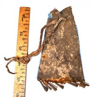 19th Century Prairie, Plains and Plateau Native American Blue, Yellow and Red Beaded Pouch with Metal Cone Shaped Bells on Edge and Rawhide Drawstring