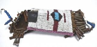 19th Century Native American White Beaded Hide Pouch with Forged Bell Trim.