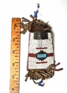 19th Century Native American White Beaded Hide Pouch with Forged Bell Trim.