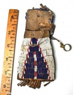 19th Century Native American White with Blue Teepee Design Beaded Hide Pouch with Brass Ring and Bell Fringe. 