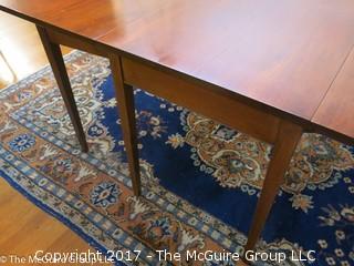 Mahogany drop leaf dining table. Collapses to fit almost anywhere, can open to fit six. Great for apartment/condo; center 24 x 48W; each leaf 24 x 48"; 30 1/2"T