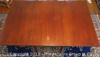 Mahogany drop leaf dining table. Collapses to fit almost anywhere, can open to fit six. Great for apartment/condo; center 24 x 48W; each leaf 24 x 48"; 30 1/2"T