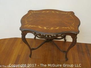 Occasional table with cabriole legs, lower stretchers and book matched marquetry top; 30W x 21L x 39"T 