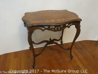 Occasional table with cabriole legs, lower stretchers and book matched marquetry top; 30W x 21L x 39"T 