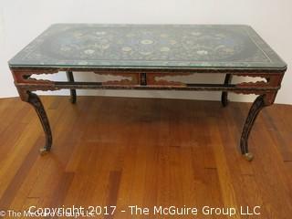 Coffee table with Chinese dragon motif top covered with glass; 22W x 44L x 21"T 