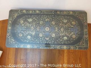 Coffee table with Chinese dragon motif top covered with glass; 22W x 44L x 21"T 