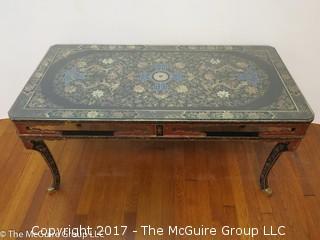 Coffee table with Chinese dragon motif top covered with glass; 22W x 44L x 21"T 