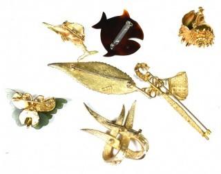 Collection of Gold Tone Vintage Brooches.  