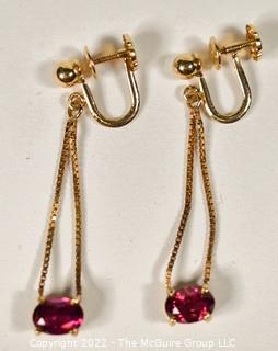 14Kt Yellow Gold with Ruby Screw Back Dangle Earrings.  Weighs 3 grams. 