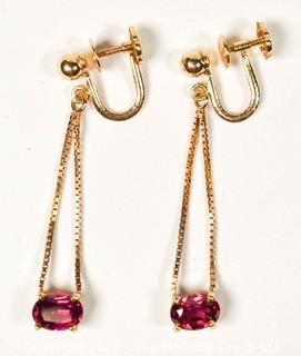 14Kt Yellow Gold with Ruby Screw Back Dangle Earrings.  Weighs 3 grams. 