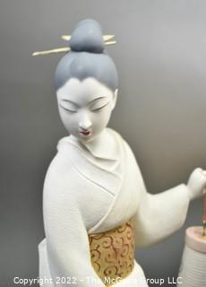 Vintage Porcelain Hand Painted White Porcelain Geisha Descending Stairs with Lantern Figurine in Glass Case with Stepped Base.  Geisha measures 16" tall.  Case measures 14" deep, 22" tall and 29" long.  Fingers have been repaired.