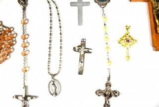 Group of Religious Jewelry Including Rosary Beads and Crucifixes.