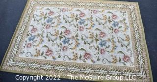 Vintage Machine Made 100% Wool Rug. Green, Rose, Blue on Cream Floral. Royal Carpet Factory Madrid Spain 1976. Measures 78 x 113" Includes new 100% wool carpet pad w/skid-resistant side. Mated Pair to 0214EC. Moth-proofed. Very Good Condition. Mated pair with Lot# 214