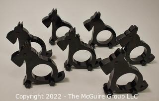 Collection of 7 wooden napkin rings in the shape of Scottie Dogs