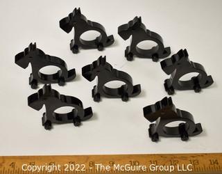 Collection of 7 wooden napkin rings in the shape of Scottie Dogs