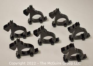 Collection of 7 wooden napkin rings in the shape of Scottie Dogs