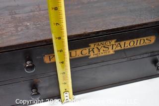 Antique Wooden Two Drawer Cabinet with Wooden Pulls. Stenciled "Fancy P.B.U. Crystaloids". Measures 16W x 16D x 6"T