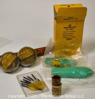 Assortment of Watchmakers Supplies including pins, oilers, Bergeon rodico. 