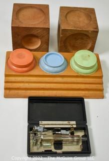 Assorted Watchmakers Tools including 3 well oil cup holder set in hardwood case and 2 wood dapping blocks.  