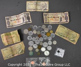 Coin: Collection of foreign coins and paper currency; also Roman Valentinian coin and US uncirculated cents