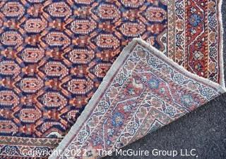 Vintage Wool Hand-Knotted Rug with Border Blue on Red Ground.   Measures 52" x 80".