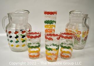 Set of Mid Century Bright Stripe Glassware and Pitchers.