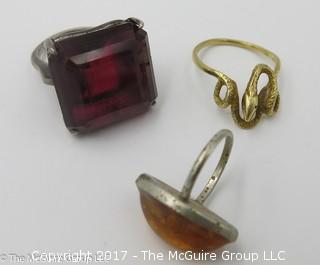 3 rings: largest stone encased in sterling, ring size 8 3/4; amber encased in sterling, ring size 3 1/4; serpent ring is 14k gold, 3.5g - #1193 