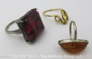 3 rings: largest stone encased in sterling, ring size 8 3/4; amber encased in sterling, ring size 3 1/4; serpent ring is 14k gold, 3.5g - #1193 