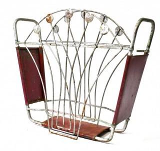 Vintage Art Deco Red Painted Cast Iron Magazine Rack. Measures 5" x 14" x 15".
