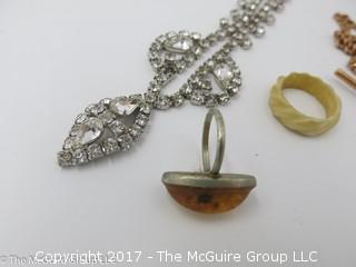 Collection of jewelry including rhinestone necklace (14 1/4"), amber ring with inclusions;  #1213