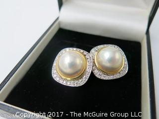 Pair of pearl (9mm x 9mm x 6mm deep)earrings surrounded by diamonds and set in 18k yellow gold; 19.6g; #1220 