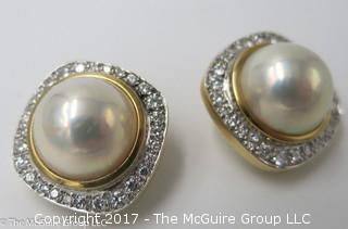 Pair of pearl (9mm x 9mm x 6mm deep)earrings surrounded by diamonds and set in 18k yellow gold; 19.6g; #1220 