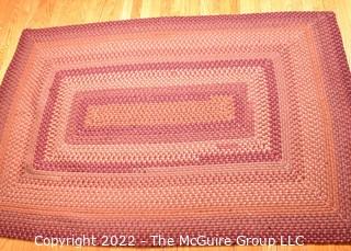 Braided Concentric Rectangle Rug in Reds. 