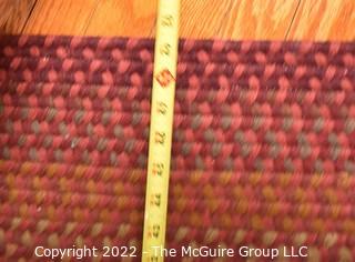 Braided Concentric Rectangle Rug in Reds. 