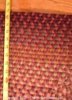 Braided Concentric Rectangle Rug in Reds. 