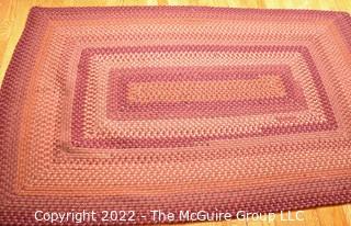 Braided Concentric Rectangle Rug in Reds. 