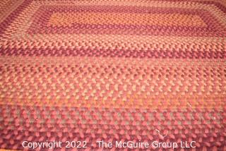 Braided Concentric Rectangle Rug in Reds. 