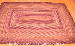 Braided Concentric Rectangle Rug in Reds. 