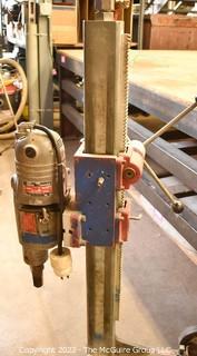 Core Drill with 7 Diamond Core Bits and 10' Tension Bar.  Needs new water valve.  