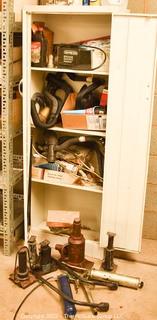 Metal 2 door cabinet and contents, including jacks, grease guns and tire irons