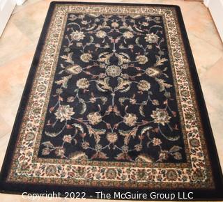 Machine Made Area Rug.  46" x 65".