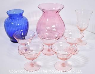 Set of Pink Glassware Including Champagne Coupes Vases. 